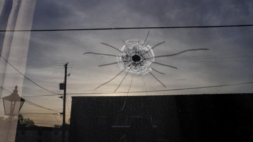 ম্যাহোগনি মাস্টারপিস ড্যান্স স্টুডিওর প্রবেশপথে বুলেটের আঘাতে কাঁচ ক্ষতিগ্রস্থ হয়। ছবি: রয়টার্স
