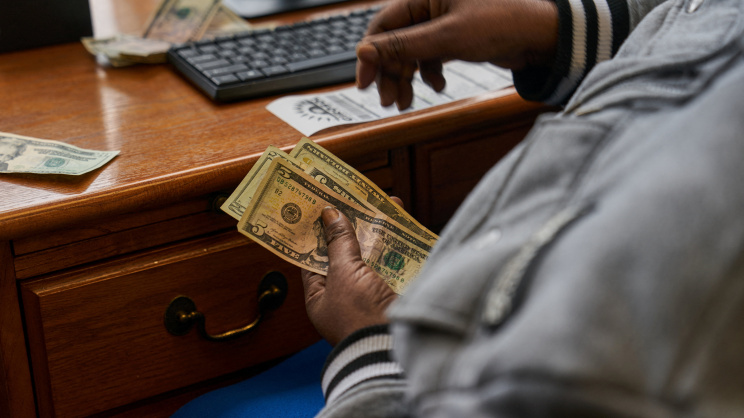 Dollar in hand