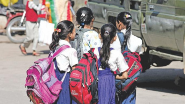 children_carry_heavy_schoolbags.jpg